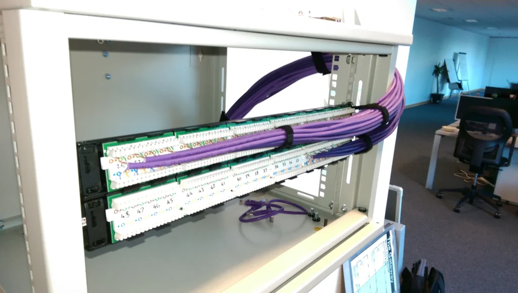 ...Terminating the patch panel. Neatness matters: reduces errors & ensures no dead ports...