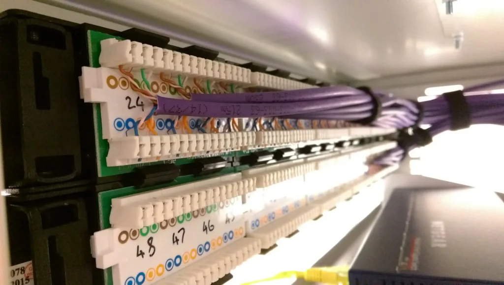 ...dressing the patch panel into position. Velcro straps are preferable to cable ties as they don’t deform the cables...